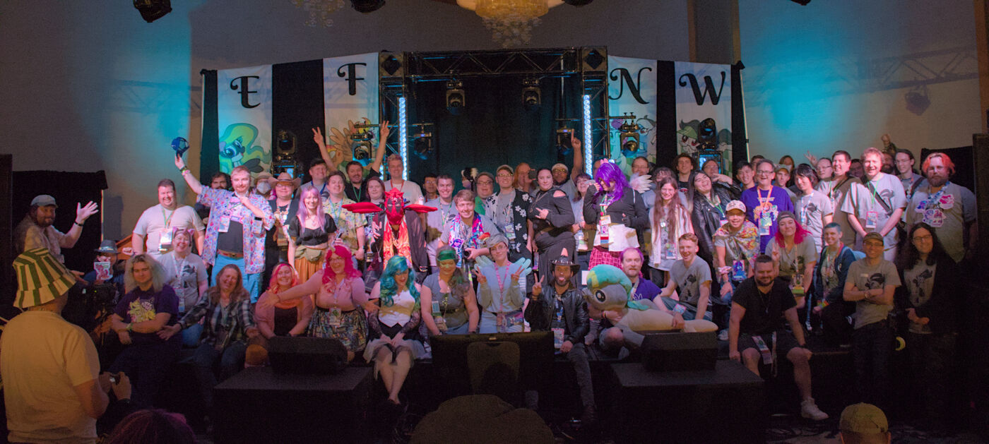 Group shot of staffers on stage.