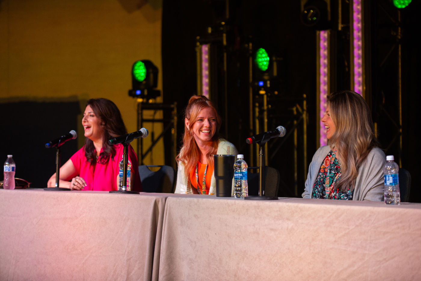 VIPs hosting a panel on stage.